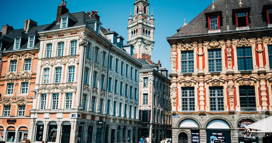 Ornate townhouses and the belfry on the Grand Place at Lille, France