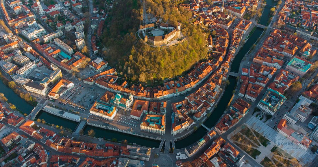 Ljubljana old town and castle above the Ljubljanica river, Ljubljana packing list for women by Roman Trail Outfitters