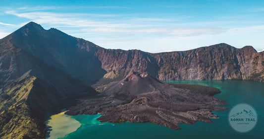 Aerial view of a volcanic island surrounded by blue water, Lombok, Indonesia