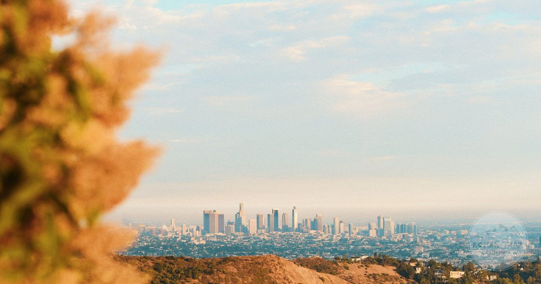 Los Angeles skyline seen from Griffith Park at golden hour, Los Angeles packing list for women by Roman Trail Outfitters
