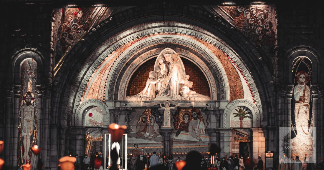 Beautiful nighttime vigil at Lourdes, France, with glowing candles and statues.