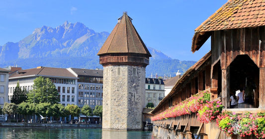 The Chapel Bridge and Water Tower on the Reuss river in Lucerne, Lucerne packing list for women by Roman Trail Outfitters