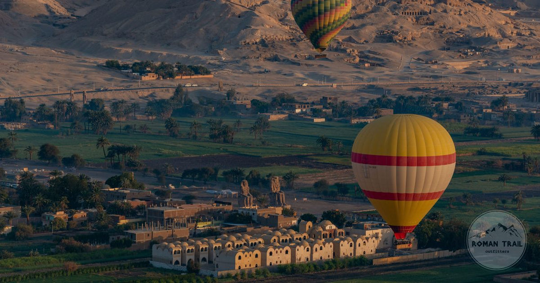 Hot air balloons rising over the fields and ancient temples of Luxor at sunrise, Luxor packing list for women by Roman Trail Outfitters
