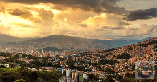 Golden hour dramatic clouds over the Medellin Colombia valley and hillside comunas, featured image for a Medellin packing list for women