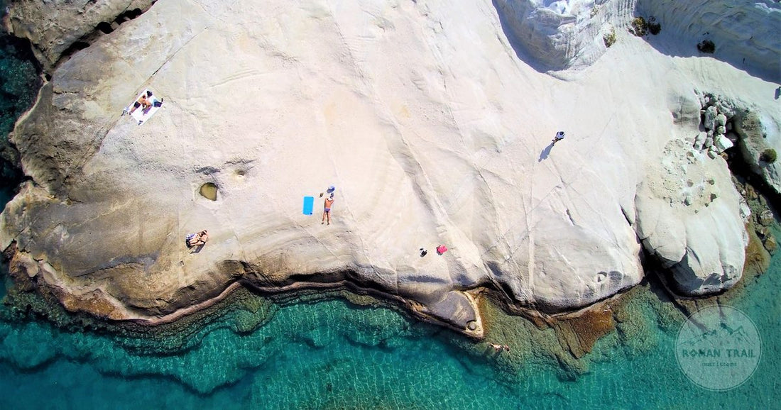 The white volcanic rock formations of Sarakiniko beach on Milos, Milos packing list for women by Roman Trail Outfitters