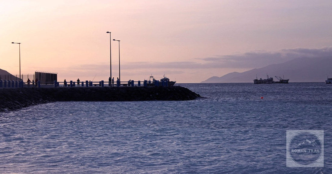 Ships and the seawall in Mindelo harbour on a still morning, Sao Vicente, Cape Verde