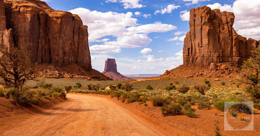 The dirt road and sandstone buttes of Monument Valley, Arizona