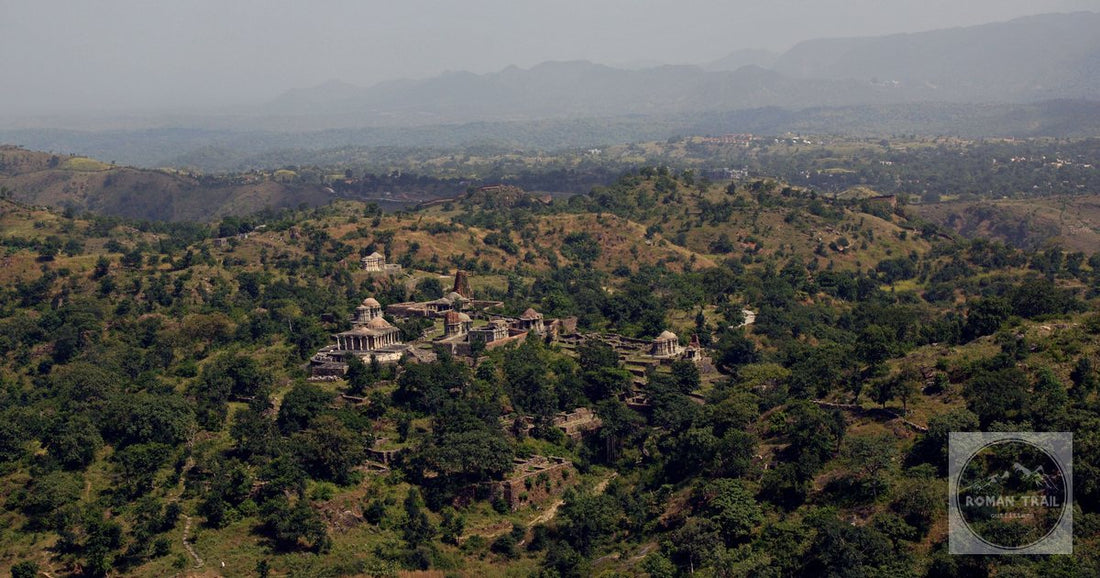 Aerial view of Dilwara Temples nestled in the lush Aravalli hills of Rajasthan, India.