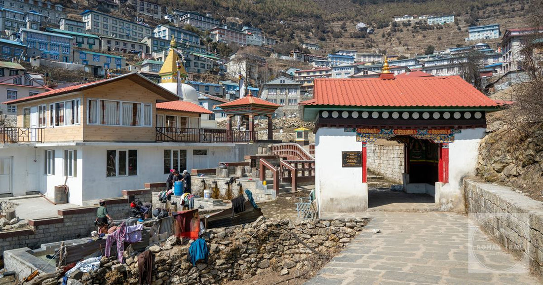 A street in Namche Bazaar, Nepal, with traditional architecture and local people
