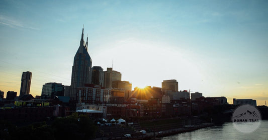 Nashville skyline at sunset above the Cumberland River, Nashville packing list for women by Roman Trail Outfitters