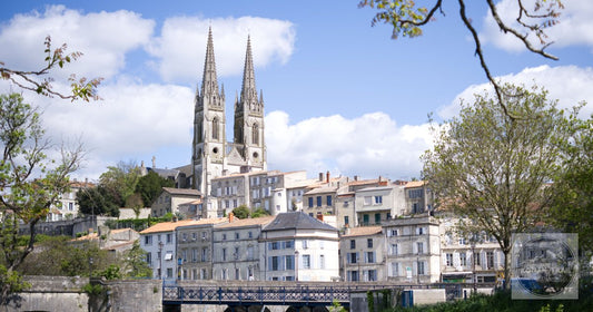 The gothic spires of Eglise Notre-Dame above the rooftops of Niort France