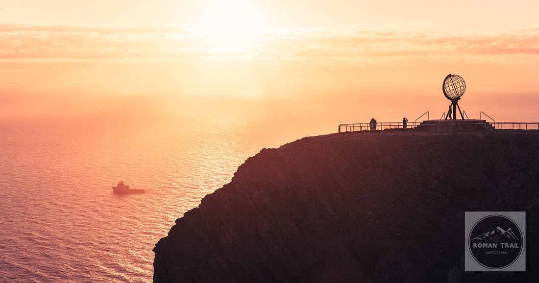 Sunset behind the globe monument at Nordkapp, Norway