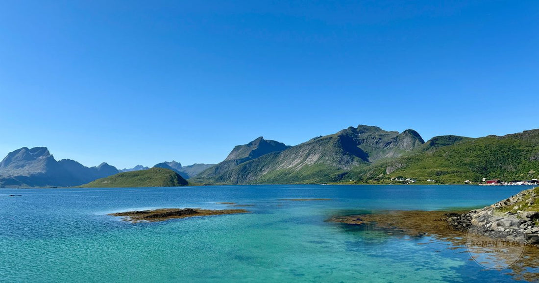Turquoise water below mountains in Nordland, Norway