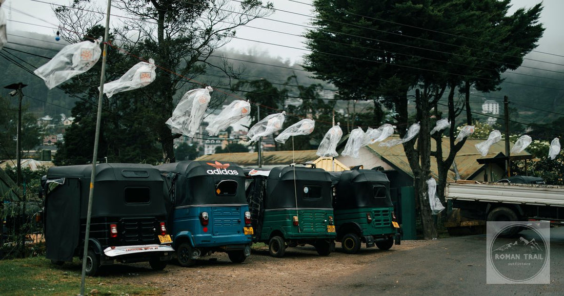 Parked tuk-tuks and misty hills in a street in Nuwara Eliya, Sri Lanka