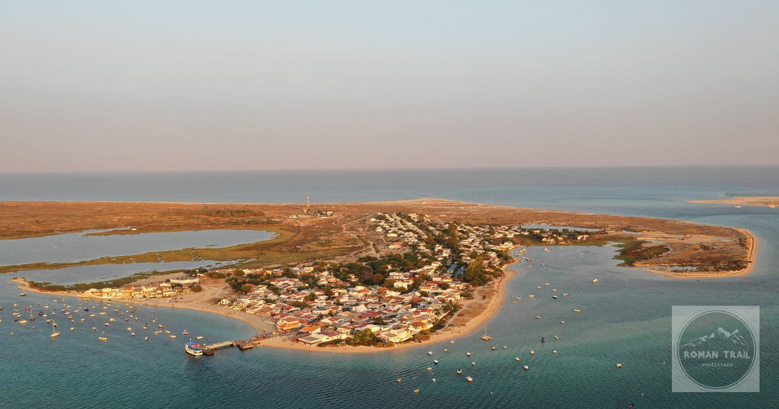 Stunning aerial shot of a coastal town in Olhão, Portugal, at sunset.
