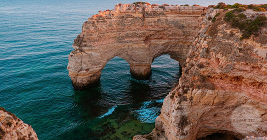 Algarve packing list for women, golden limestone cliffs at sunset Portugal