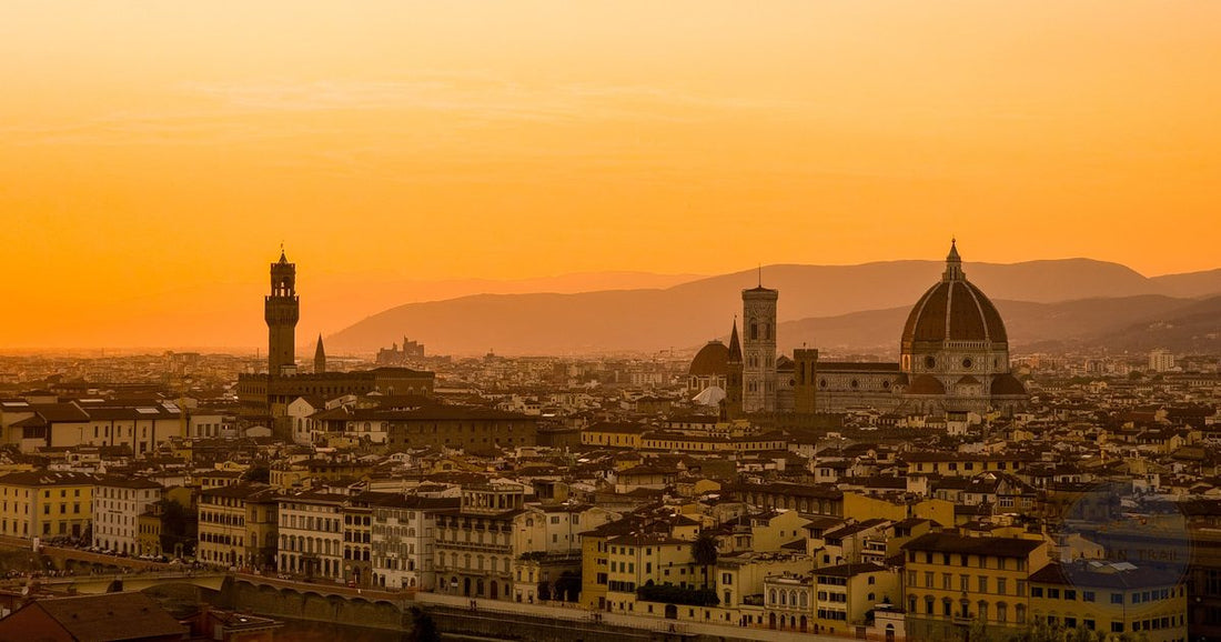 Florence skyline with the Duomo silhouetted against a warm orange sunset - Roman Trail Outfitters Italy packing list