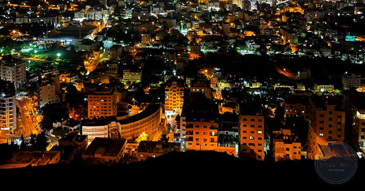 Nablus old city glowing at night in the West Bank hills, Palestine women's packing list destination