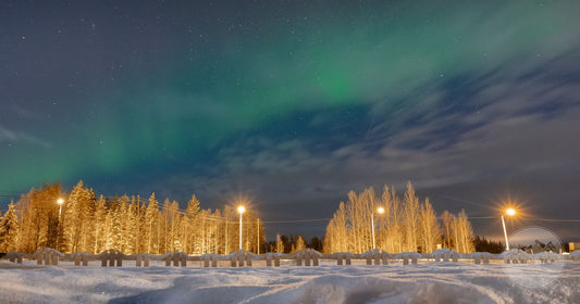 Rovaniemi packing list for women, northern lights over snowy Lapland Finland