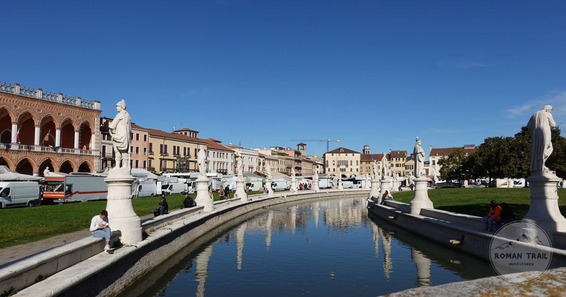 Statues and reflection in the water at the Prato della Valle, Padua, Italy