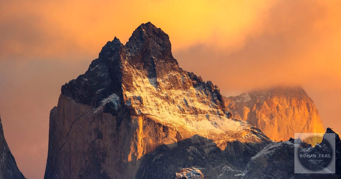 Dramatic granite peak glowing in warm golden sunrise light in Patagonia, featured image for a Patagonia packing list for women