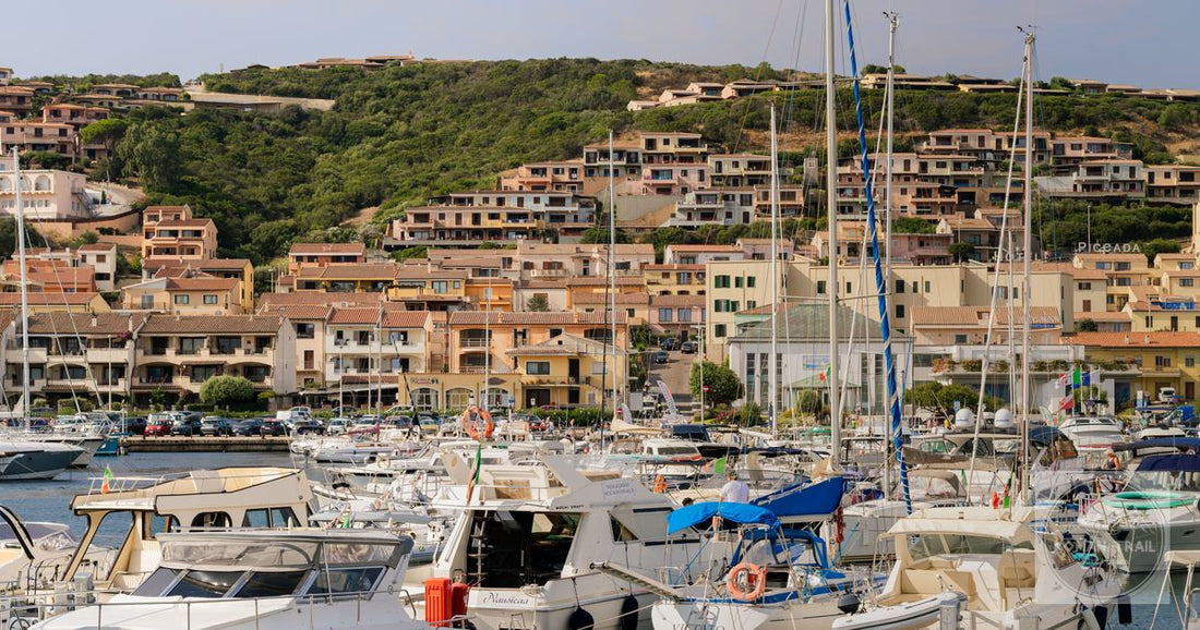 Porto Cervo marina with yachts and hillside houses, Sardinia
