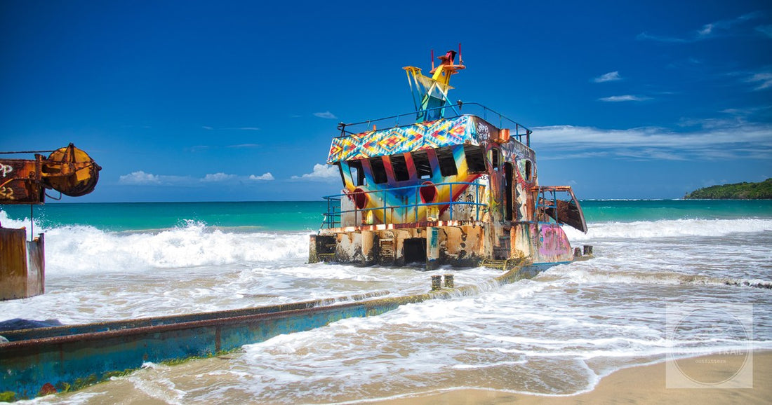 A colourful shipwreck on the sand on the Caribbean coast at Limon, Costa Rica