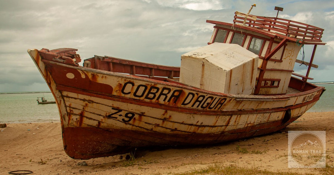The rusting wooden boat Cobra Dagua on the beach at Punta del Diablo, Uruguay
