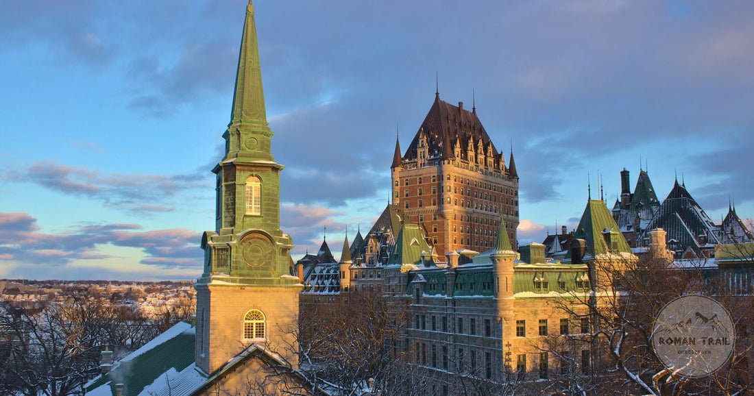 Chateau Frontenac and Old Quebec at sunset with snow-covered trees, Canada