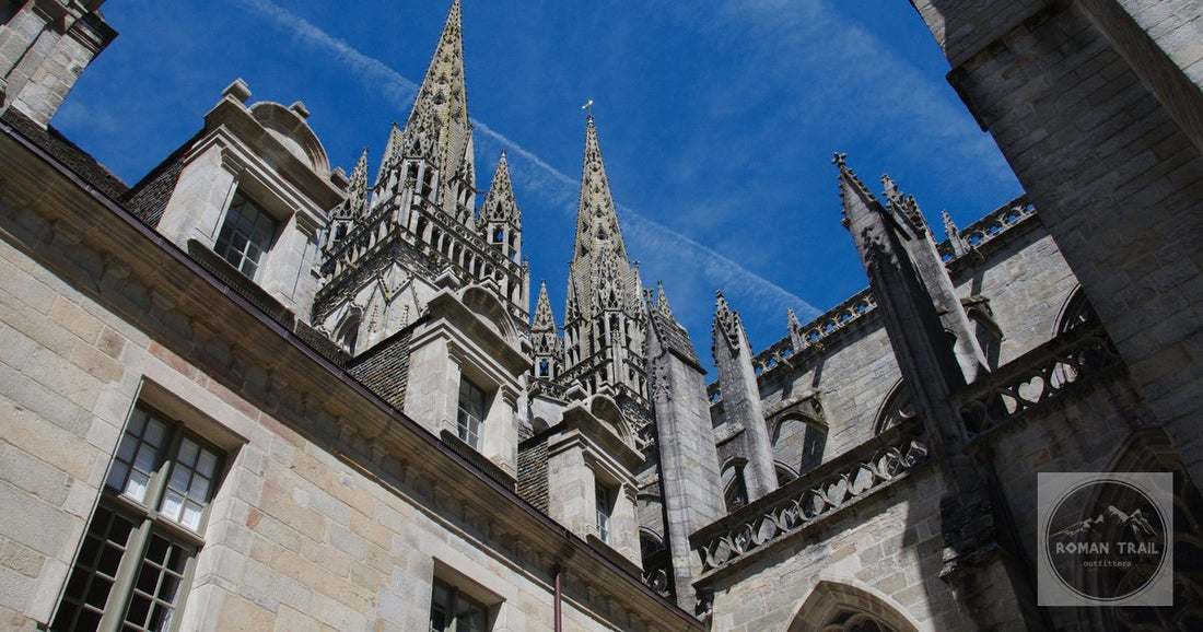 Low-angle view of the Gothic architecture of Saint Corentin Cathedral in Quimper, France.