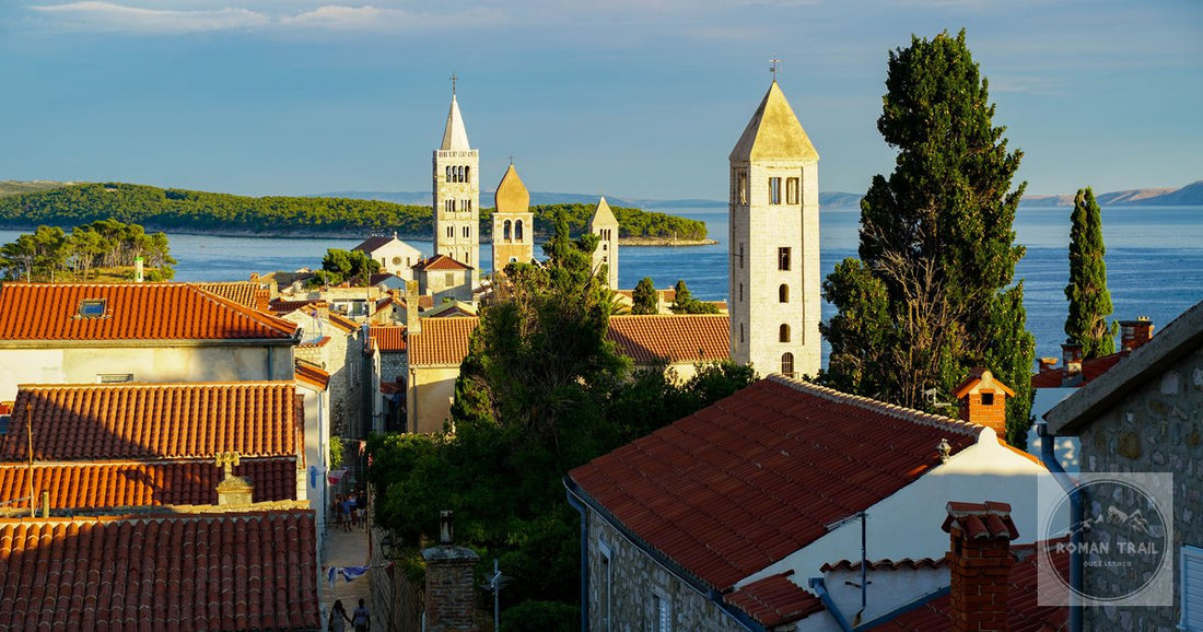 An aerial view of the bell towers and coast of Rab town, Croatia