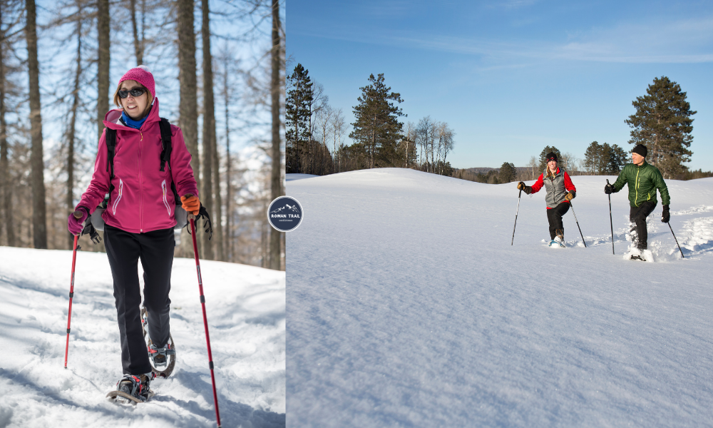 Woman snowshoeing through a snowy forest wearing layered winter hiking clothing