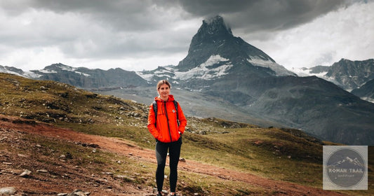 Woman hiking with the Matterhorn in view, Switzerland packing list for women by Roman Trail Outfitters