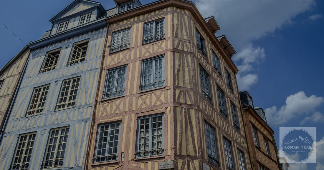 Vibrant traditional half-timbered building under a clear sky in Rouen, Normandie.
