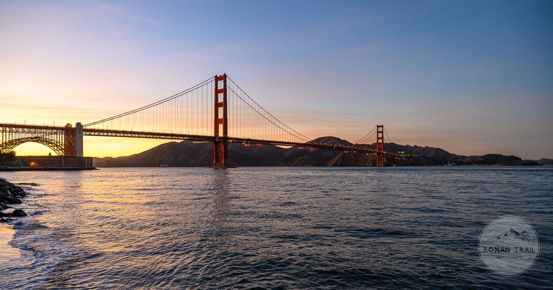 Golden Gate Bridge at sunset above San Francisco Bay, San Francisco packing list for women by Roman Trail Outfitters