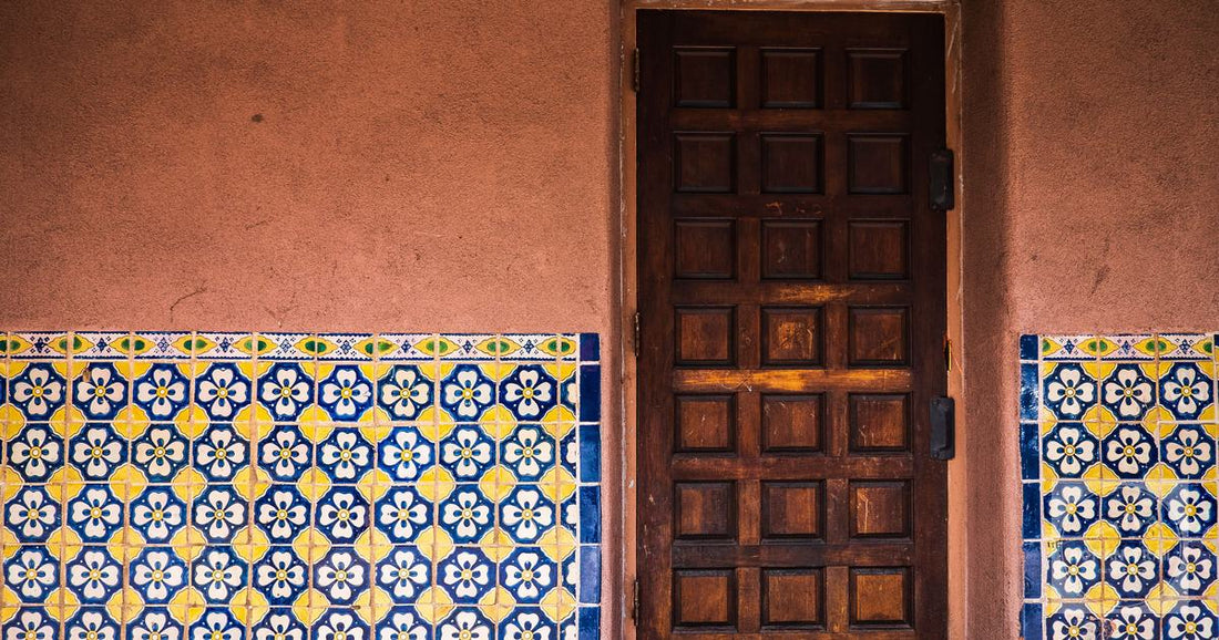 A rustic wooden door with patterned tiles in Santa Fe, New Mexico