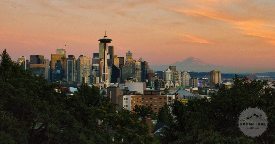 Seattle skyline with the Space Needle and Mount Rainier at sunset, Seattle packing list for women by Roman Trail Outfitters