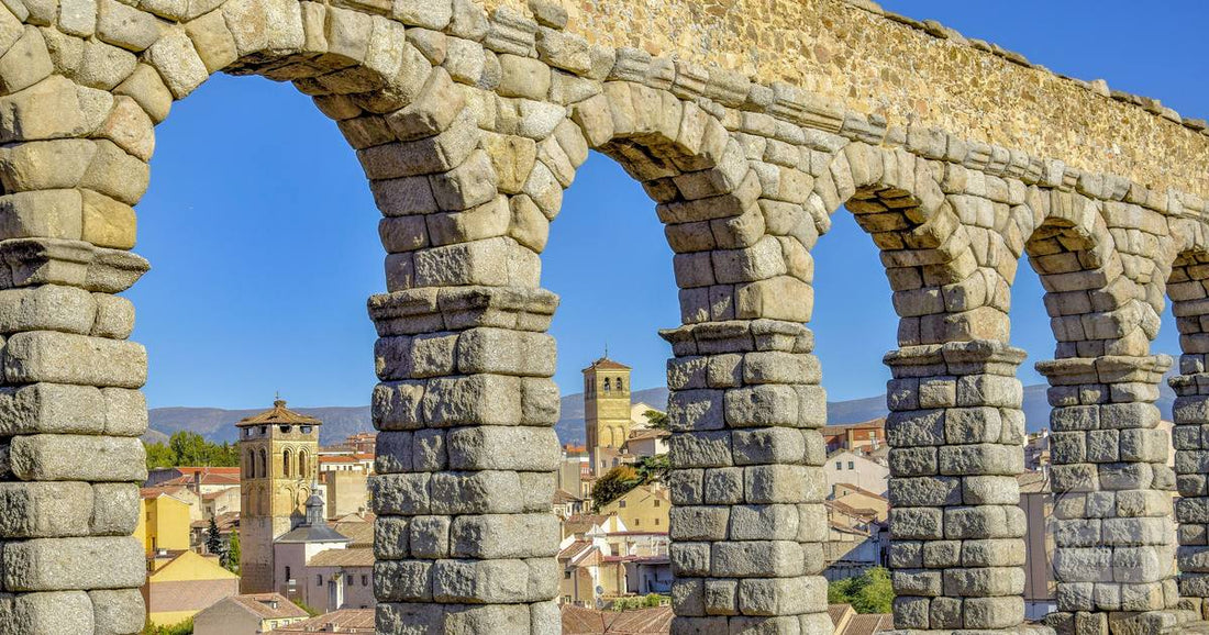 The Roman aqueduct arches above the city of Segovia, Spain