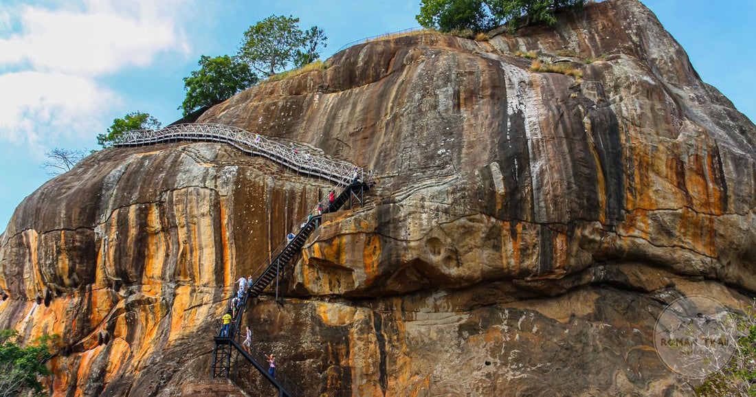 The Sigiriya rock fortress rising above green forest in Sri Lanka