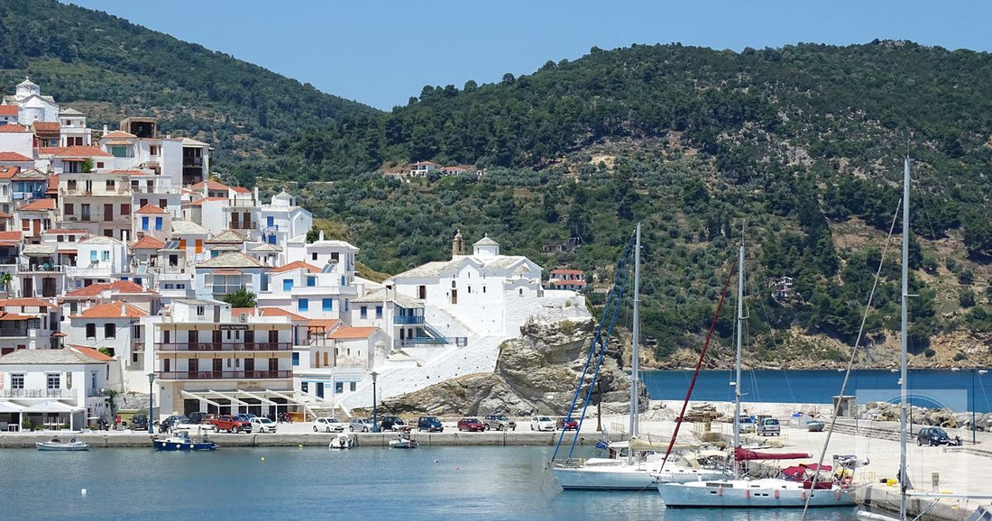 Colourful buildings and yachts in Skopelos town, Greece