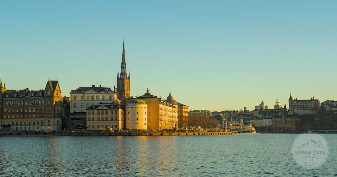 Riddarholmen and the Gamla Stan waterfront lit gold at sunset, Stockholm packing list for women by Roman Trail Outfitters