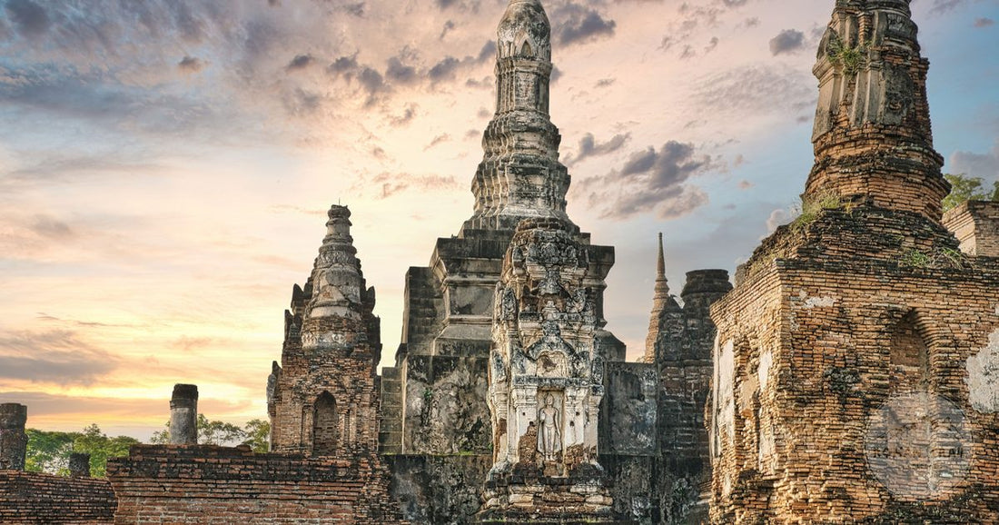 The ruins of Wat Mahathat at sunset in Sukhothai, Thailand