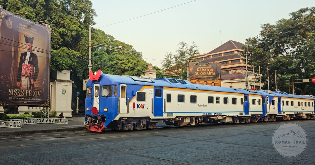 A commuter train passing the Karaton Surakarta, Central Java, Indonesia