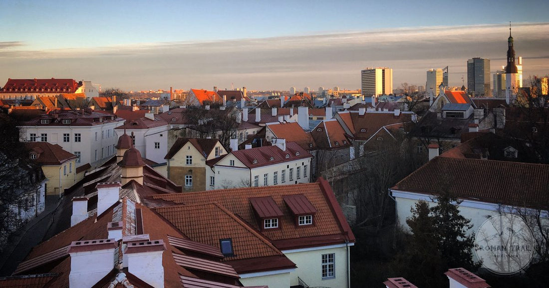 Red-tiled rooftops of Tallinn Old Town at golden hour, Tallinn packing list for women by Roman Trail Outfitters