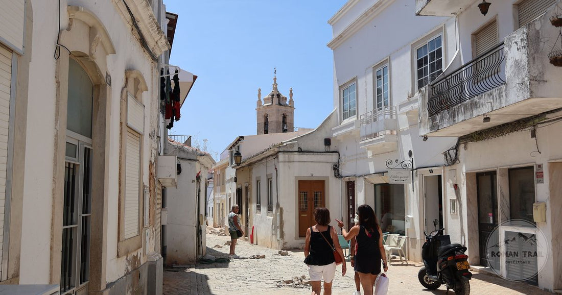 A cobbled street of historic houses at Tavira, Portugal