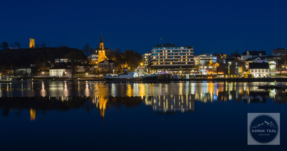 The Tonsberg waterfront lit and reflected in the water at night, Norway