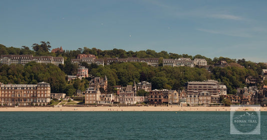 Scenic view of Trouville-sur-Mer beach and charming architecture in Normandy, France under a clear blue sky.