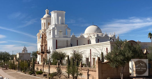 Beautiful view of Mission San Xavier Del Bac with cactus garden in Tucson, Arizona.