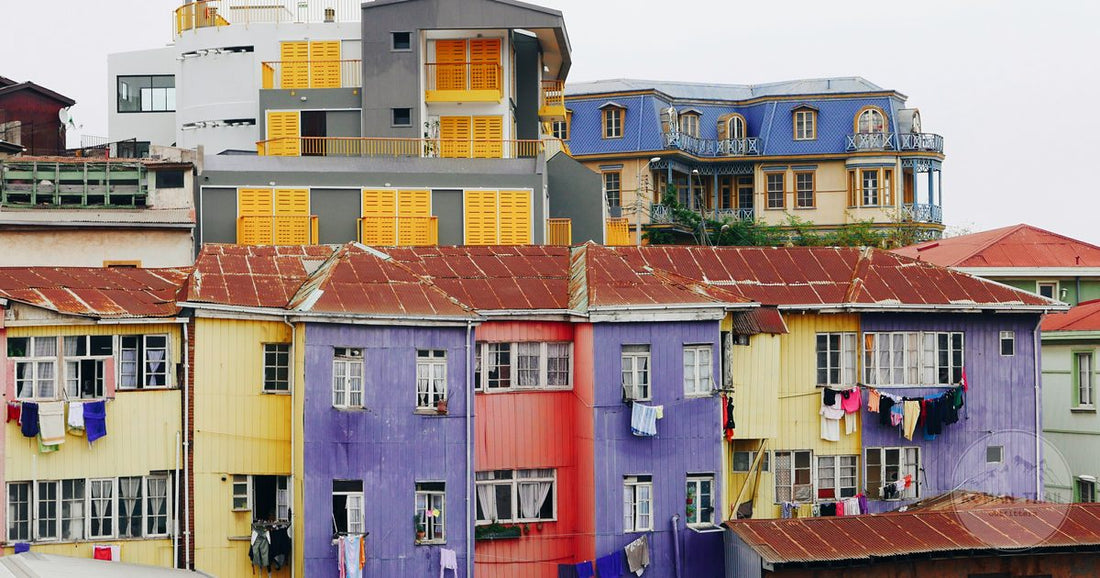 Brightly painted houses stacked on a Valparaiso cerro, Valparaiso packing list for women by Roman Trail Outfitters