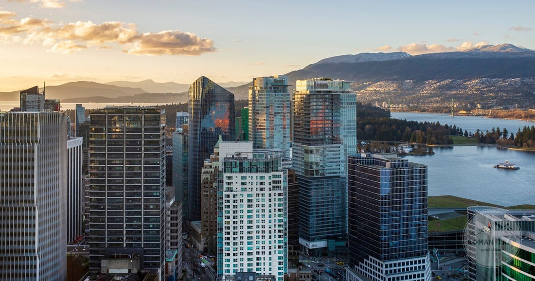 Vancouver skyline at sunset with the North Shore Mountains behind, Vancouver packing list for women by Roman Trail Outfitters